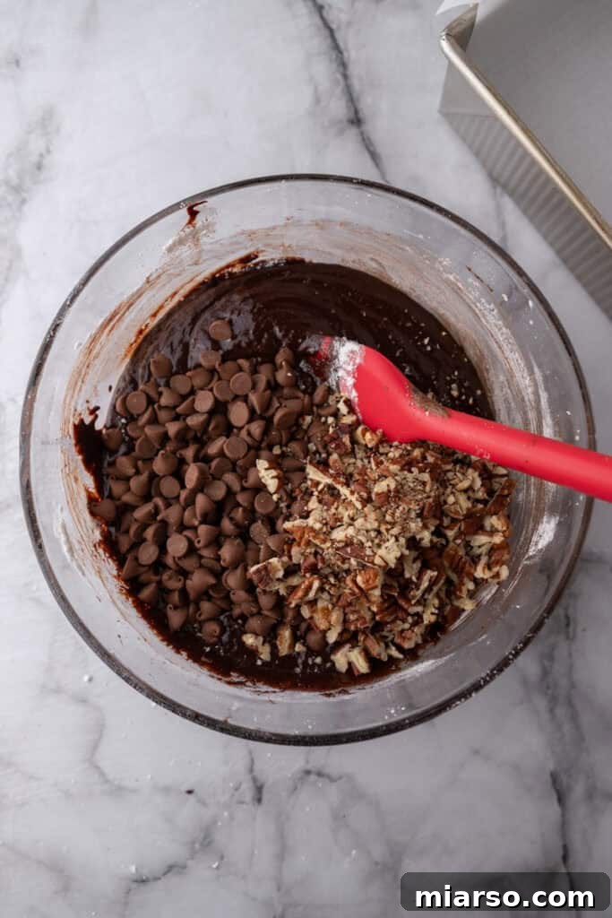 Mastering the World's Best Fudgy Brownies 13 Brownie batter with chocolate chips and nuts