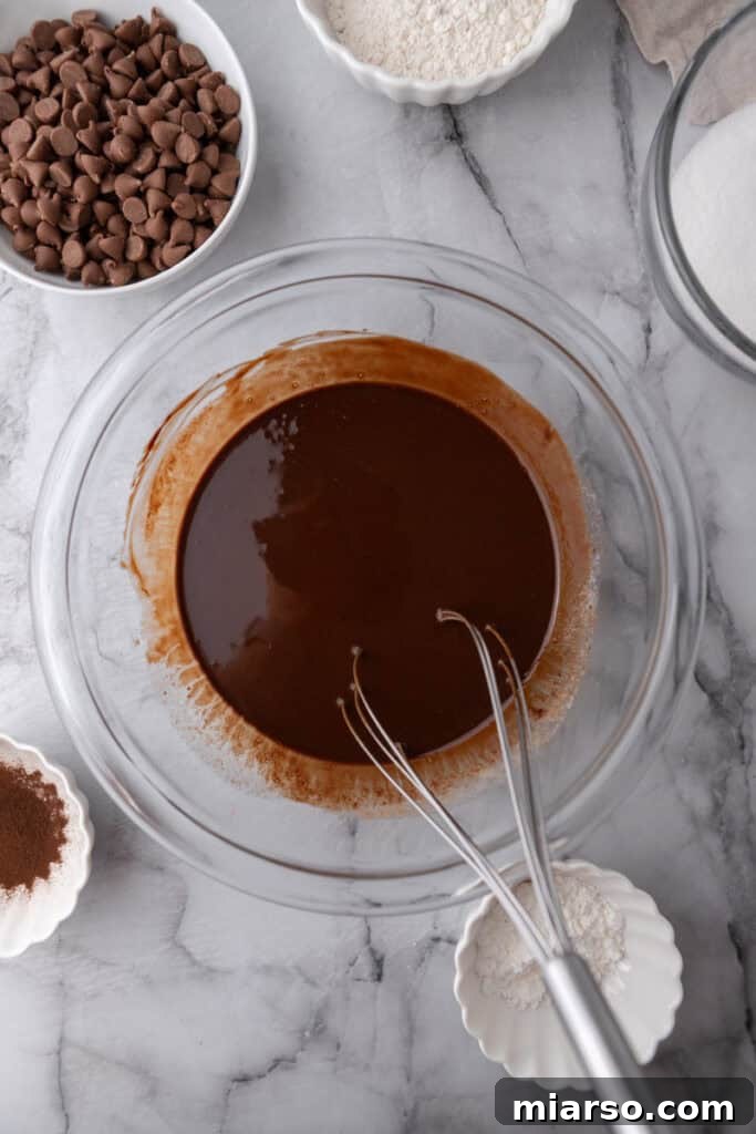 Mastering the World's Best Fudgy Brownies 6 Melted chocolate with butter and oil in a bowl