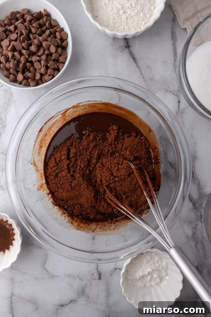 Mastering the World's Best Fudgy Brownies 7 Cocoa powder in a bowl full of melted chocolate
