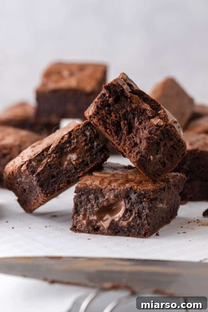 Fudgy Brown Butter Brownies stacked on top of each other