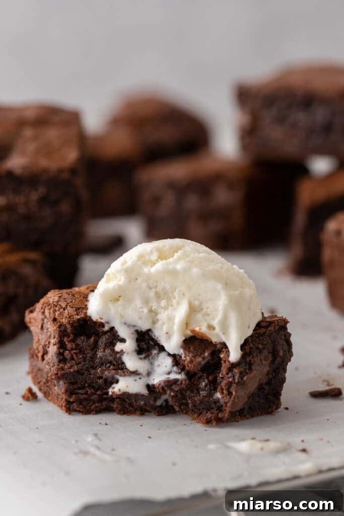 Fudgy Brown Butter Brownie with ice cream on top