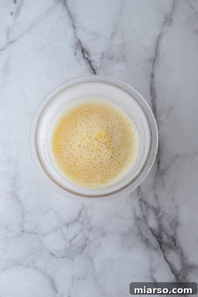 Frozen ice cream base in Ninja Creami pint container