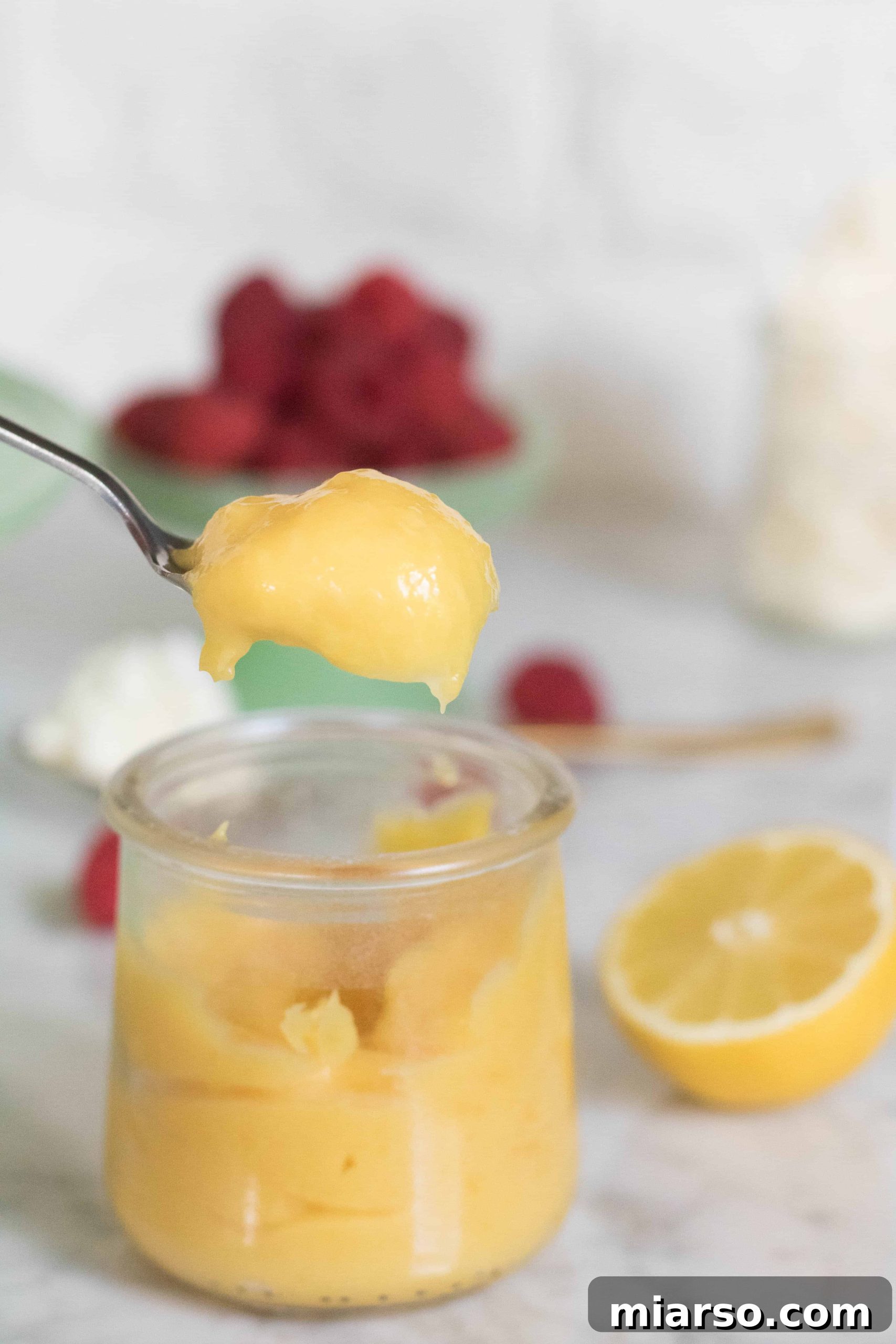 Lemon curd for the layered vanilla cake, showing its smooth texture
