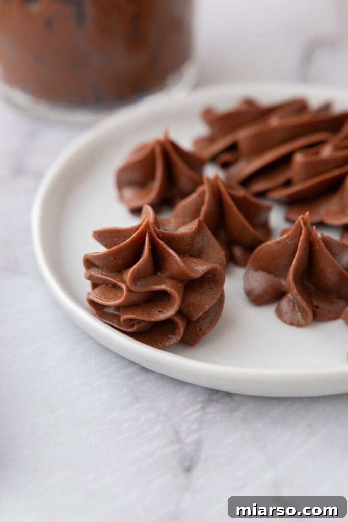 Decadent one-bowl chocolate buttercream recipe on a plate, ready to be enjoyed.