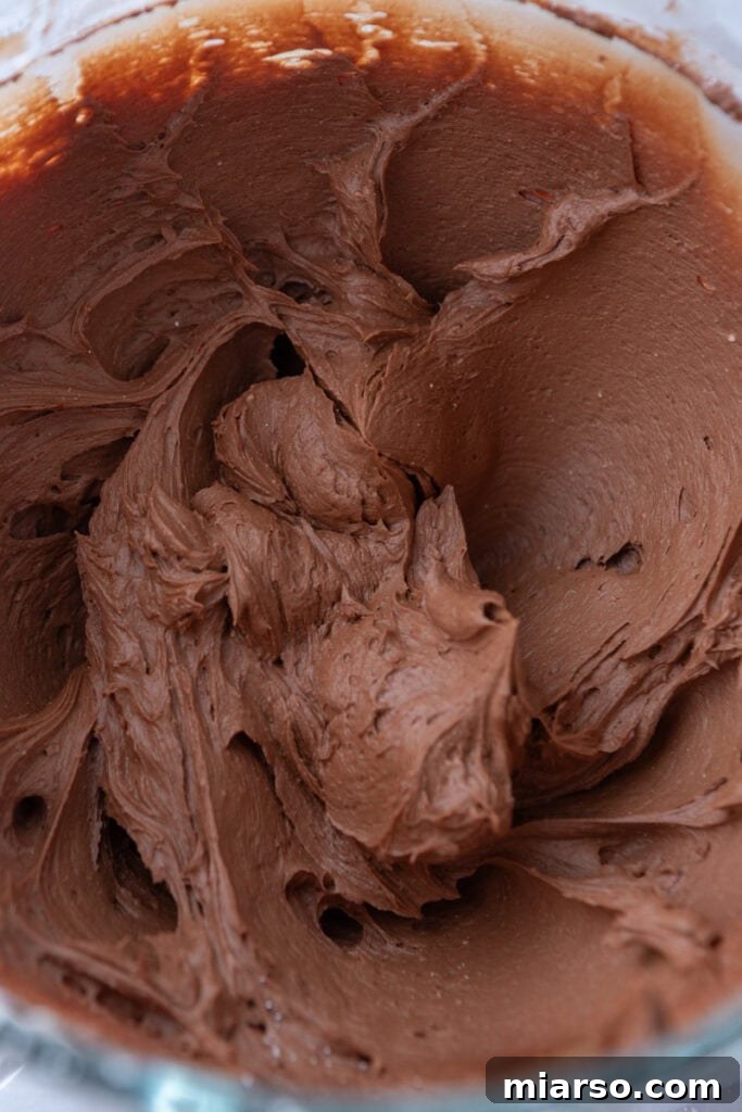 A bowl of creamy one-bowl chocolate buttercream recipe.
