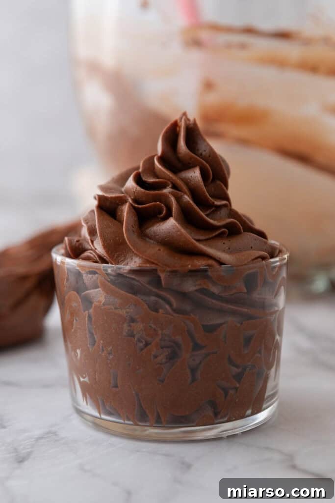Another view of the delicious one-bowl chocolate buttercream recipe in a cup.