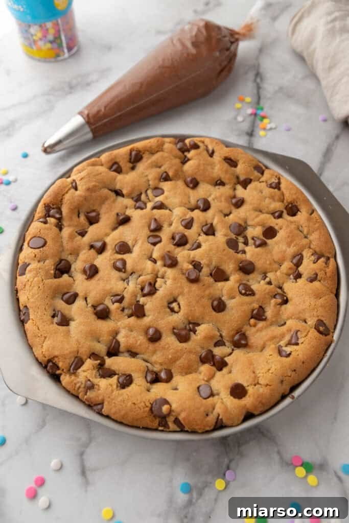 The Ultimate Homemade Chocolate Chip Cookie Cake 11 Freshly baked cookie cake in the pan