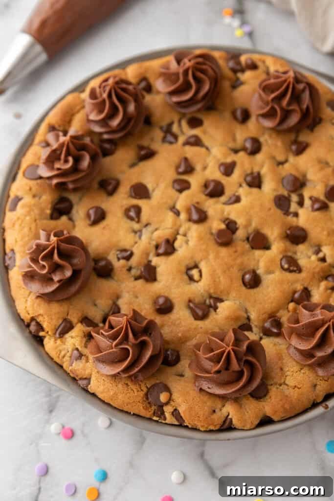 The Ultimate Homemade Chocolate Chip Cookie Cake 12 Cookie cake cooling on a wire rack