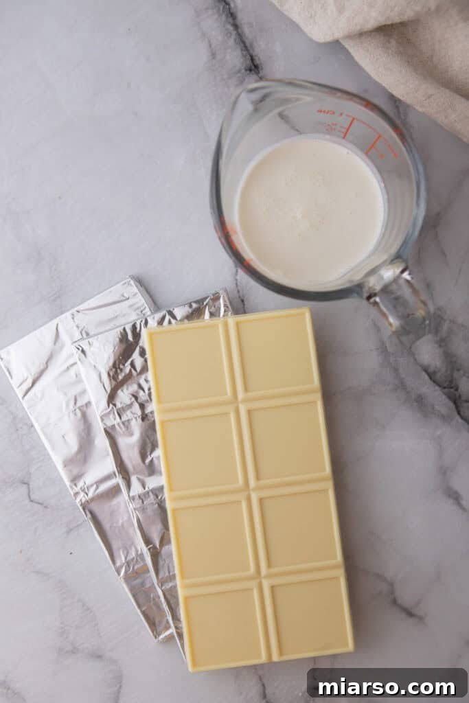 ingredients for white chocolate ganache recipe laid out