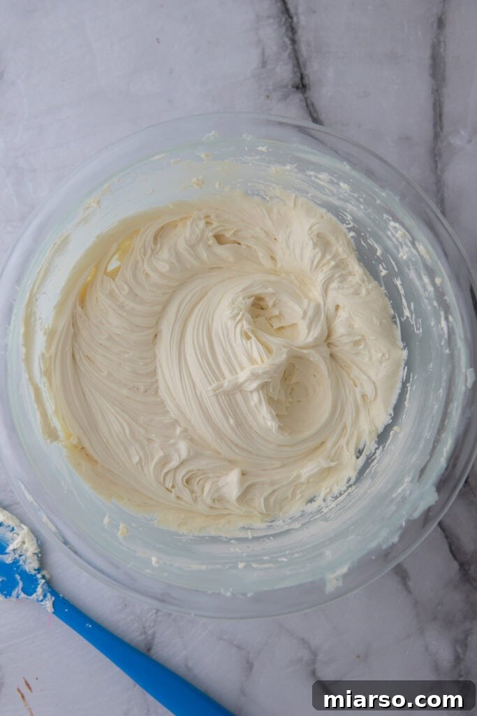 white chocolate ganache recipe in a bowl with a spoon
