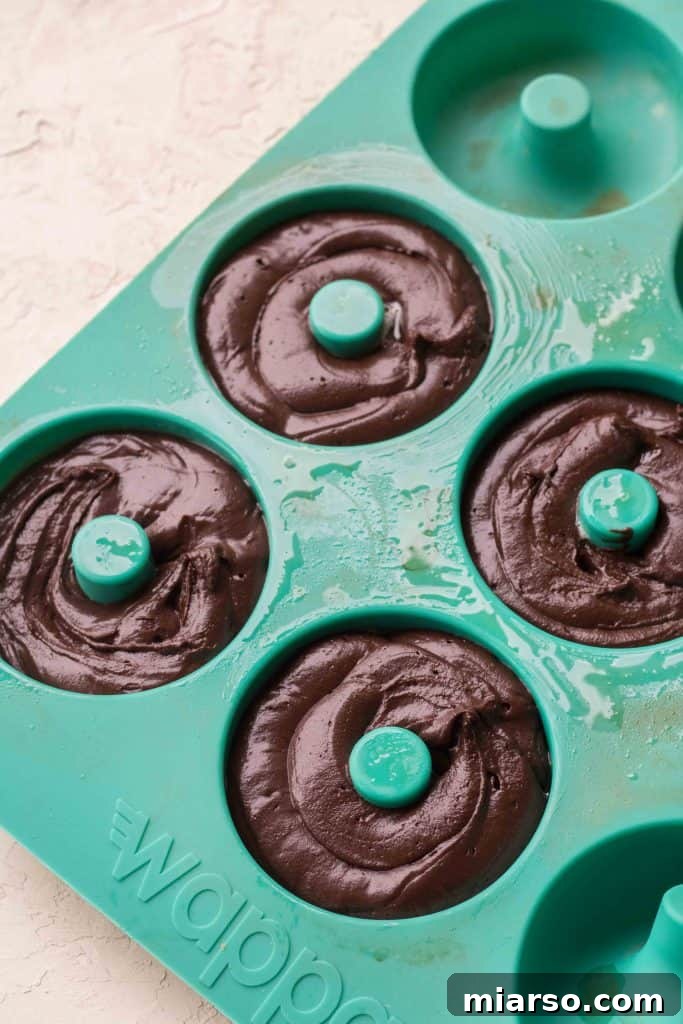 Steps for mixing chocolate donut batter and piping into pan