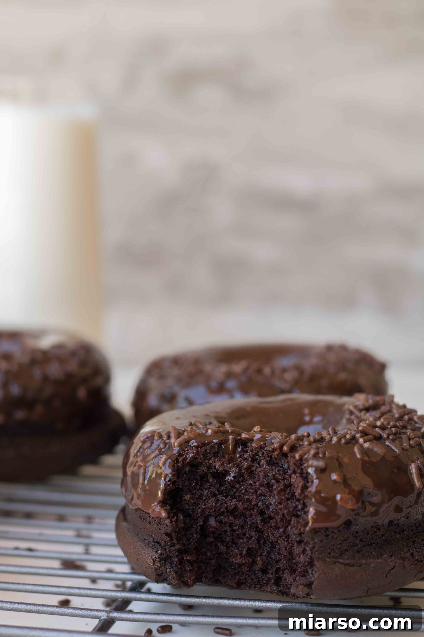 Stack of glazed baked chocolate donuts