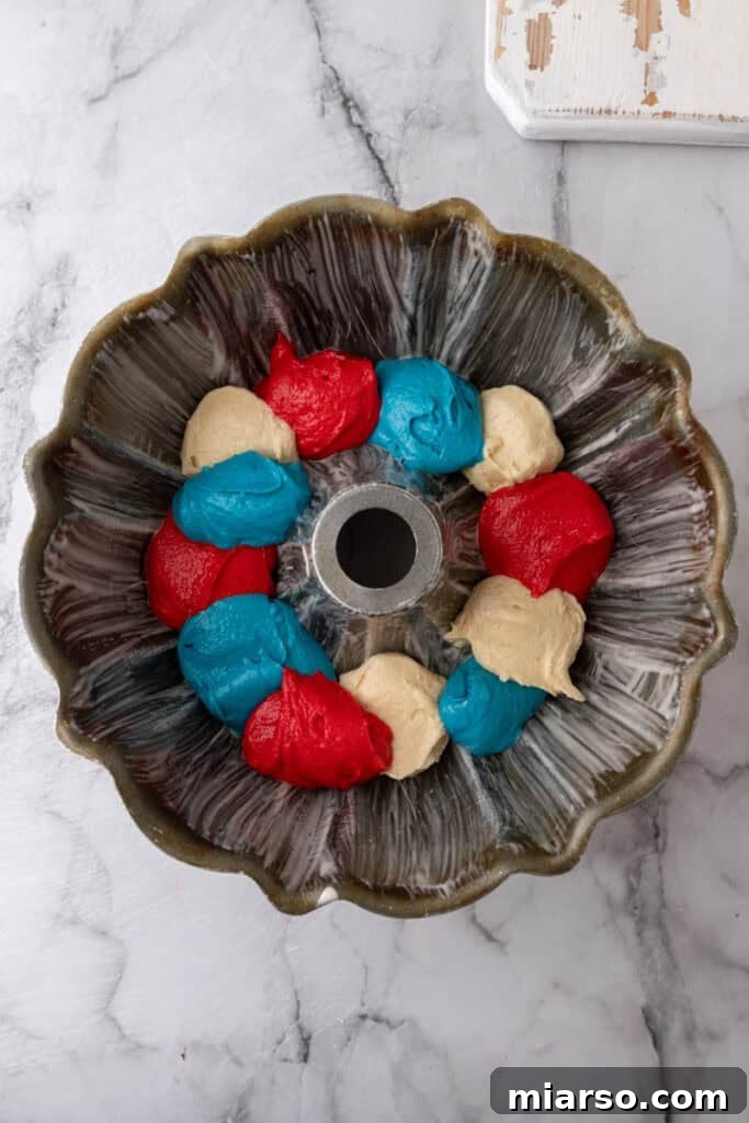 Showstopping Stars and Stripes Bundt Cake 12 batter in a pan