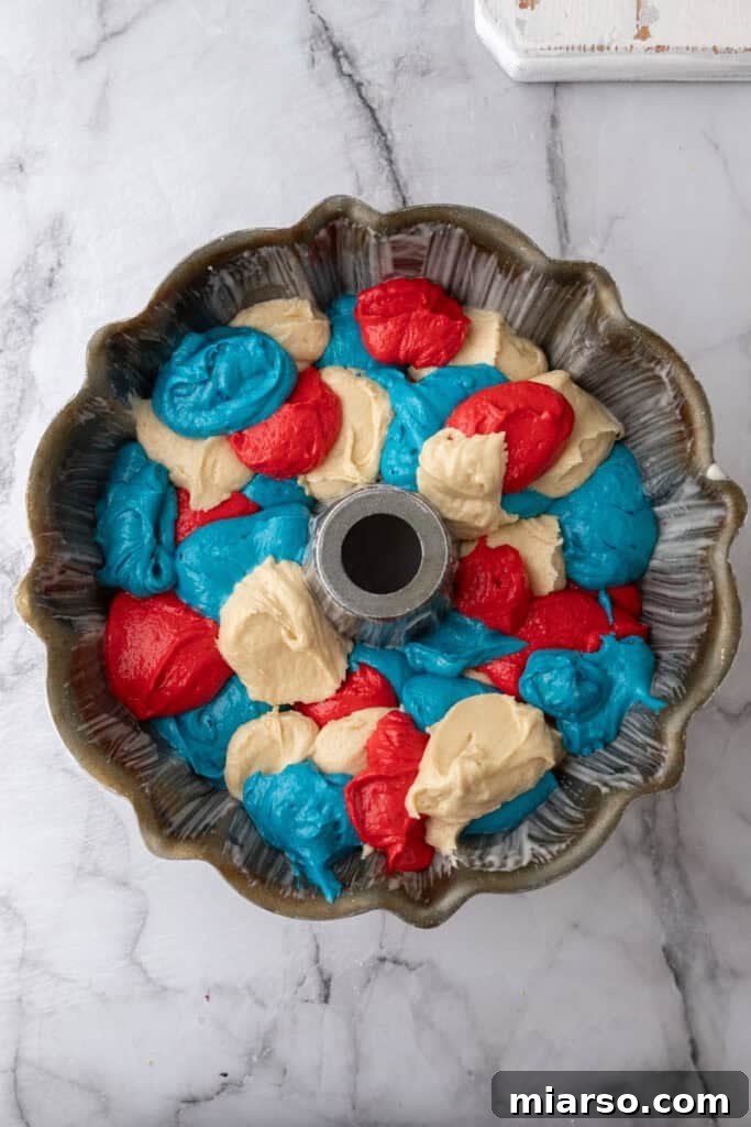 Showstopping Stars and Stripes Bundt Cake 13 batter in a pan