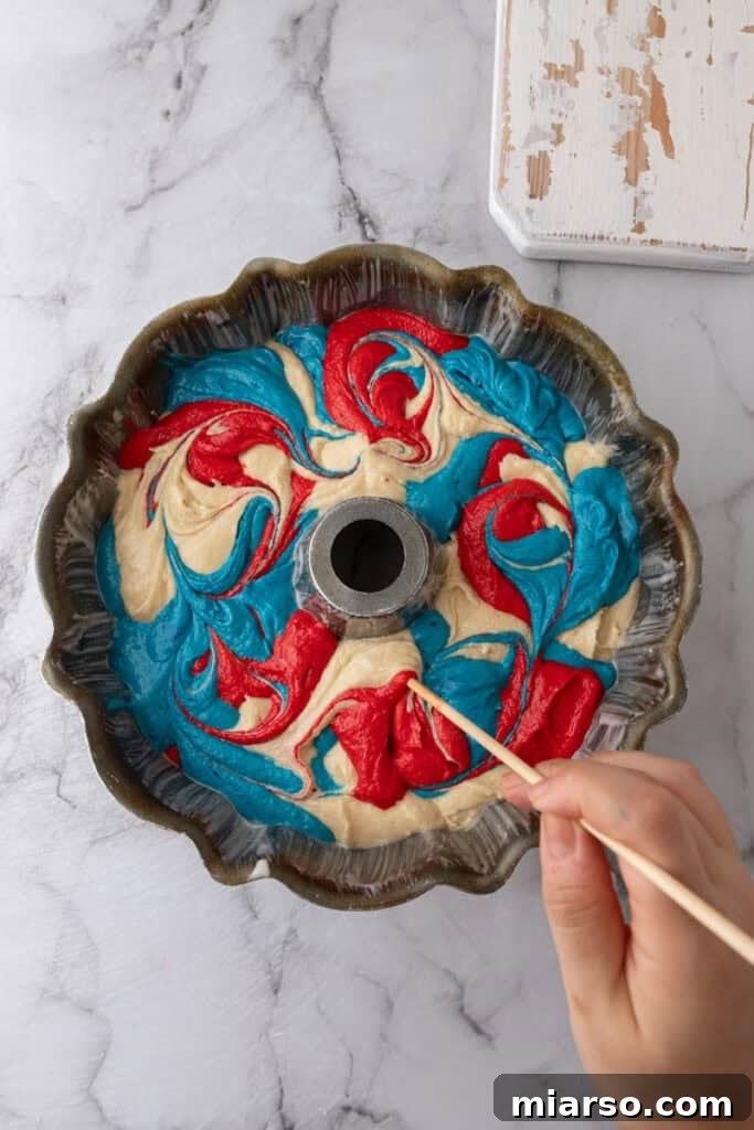 Showstopping Stars and Stripes Bundt Cake 14 batter in a pan