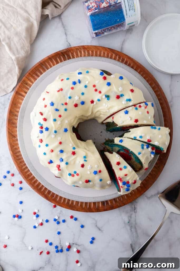Showstopping Stars and Stripes Bundt Cake 17 fully made red white and blue bundt cake recipe with frosting on it