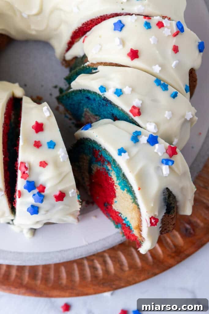 Showstopping Stars and Stripes Bundt Cake 20 fully made red white and blue bundt cake recipe with frosting on it