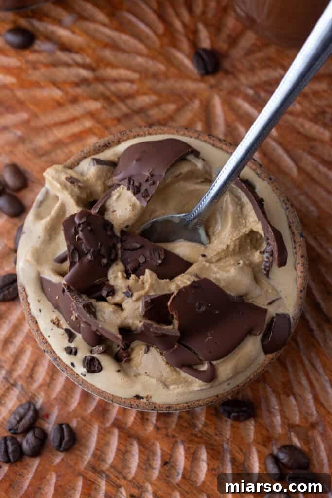 Easy 5-Minute Magic Chocolate Shell for Ice Cream 11 Overhead shot of magic chocolate shell artfully drizzled on top of ice cream.