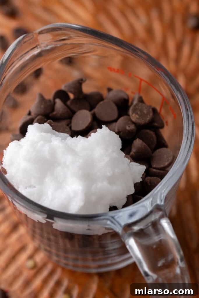 Easy 5-Minute Magic Chocolate Shell for Ice Cream 5 Chocolate and coconut oil in a small cup, prior to melting.