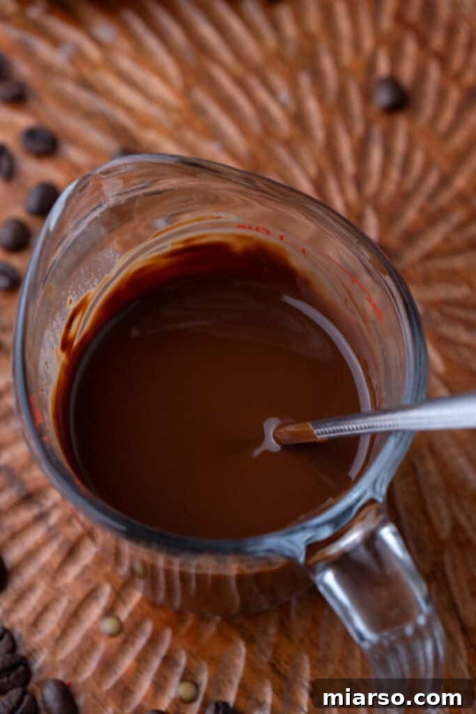 Easy 5-Minute Magic Chocolate Shell for Ice Cream 6 Melted chocolate and coconut oil in a cup, showing smooth consistency.