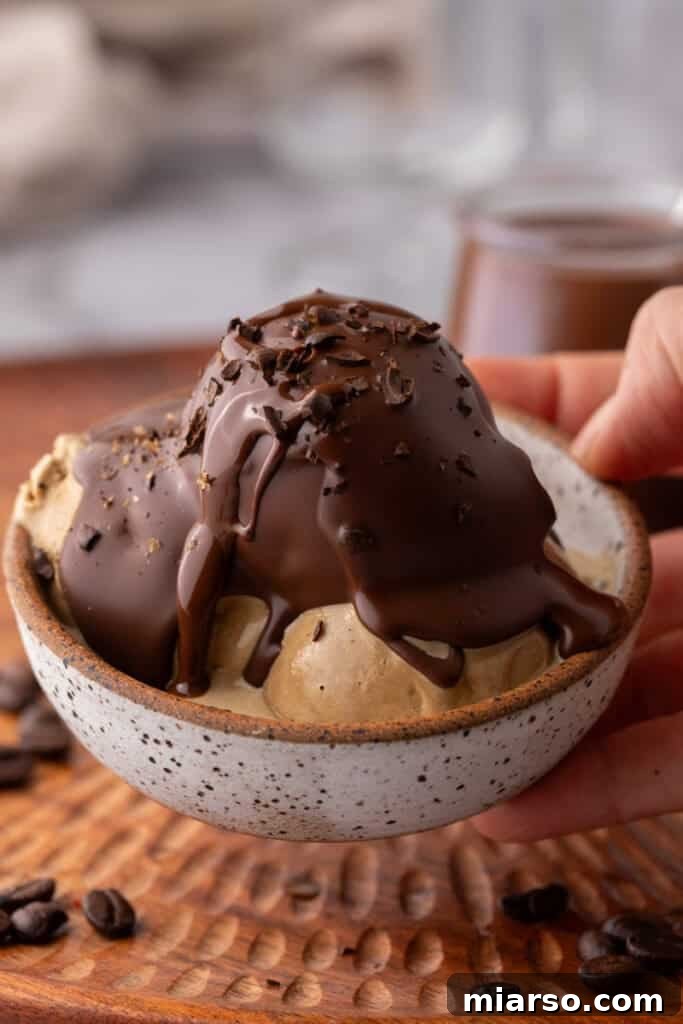 Easy 5-Minute Magic Chocolate Shell for Ice Cream 10 Close-up of magic chocolate shell on top of creamy vanilla ice cream.