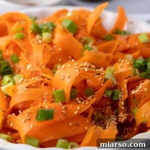 A close-up of the vibrant Carrot Ribbon Salad, ready to be enjoyed.