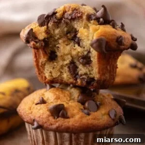 Banana Chocolate Chip Muffins stacked on top of each other