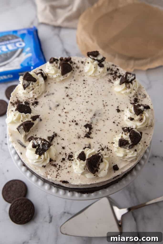 No Bake Oreo Cheesecake Recipe slice on a plate, featuring the creamy filling and crunchy crust