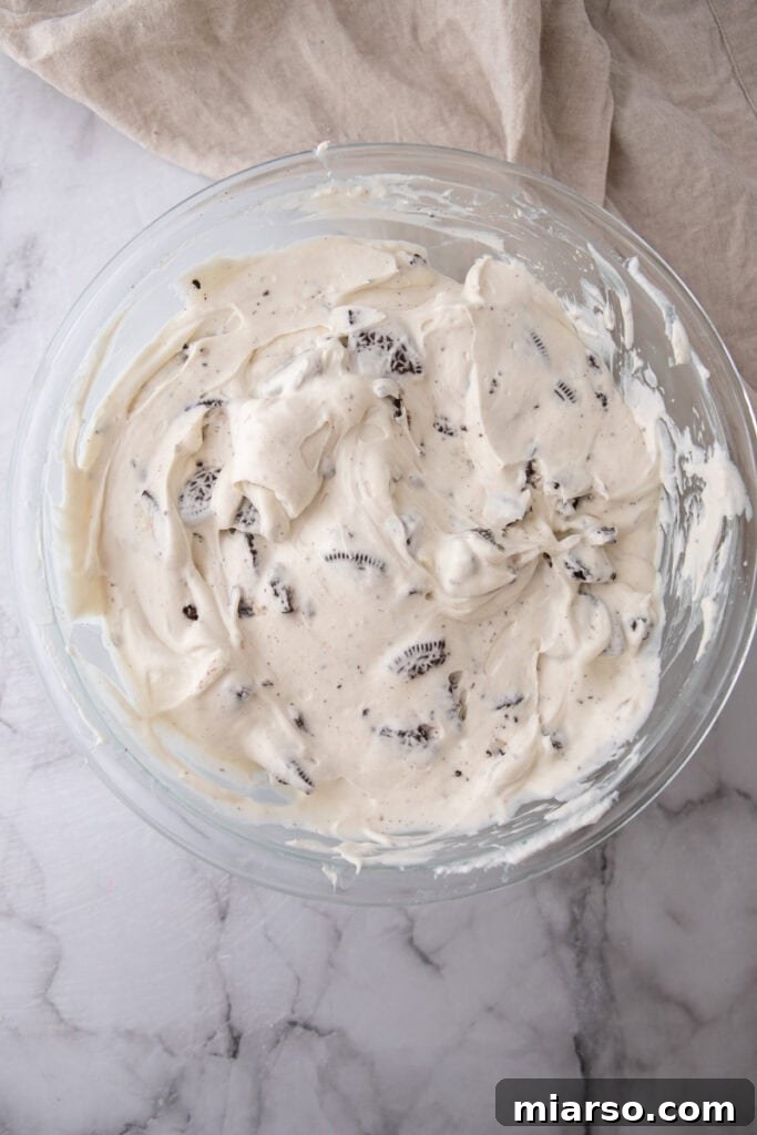 Cheesecake filling with chopped Oreos mixed in, ready for the crust
