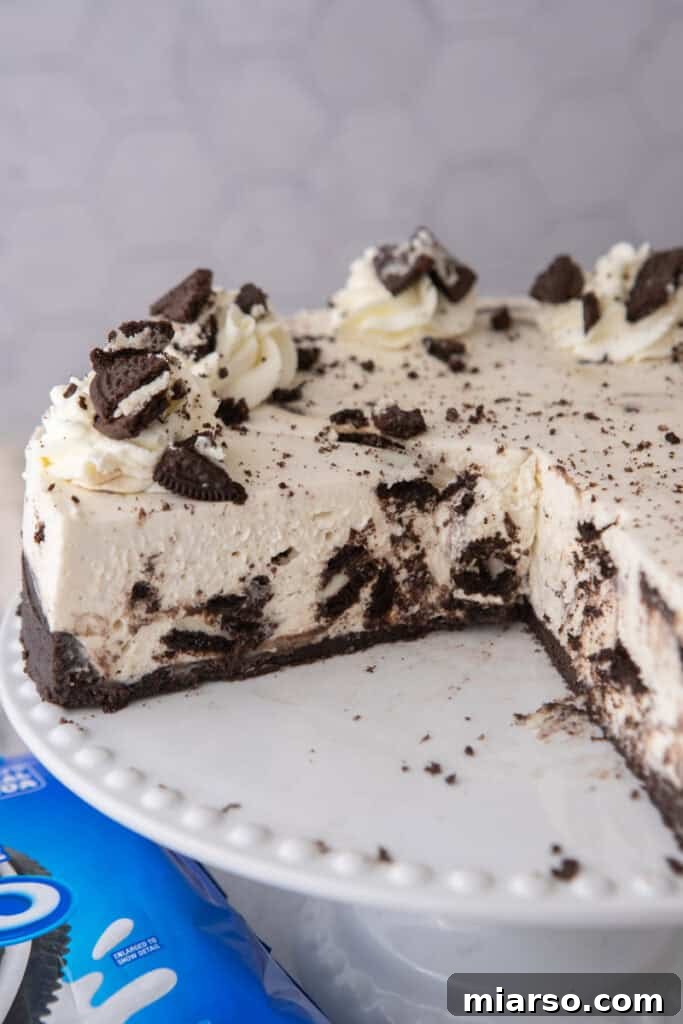A beautifully plated slice of No Bake Oreo Cheesecake, showcasing the layers and toppings