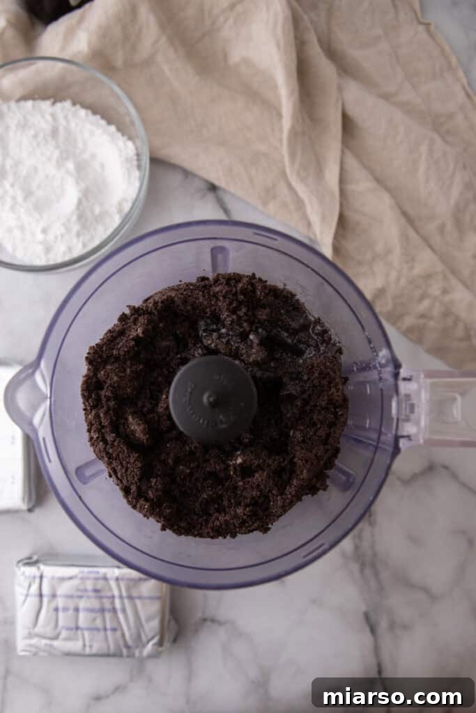 Oreo cookies being crushed in a food processor