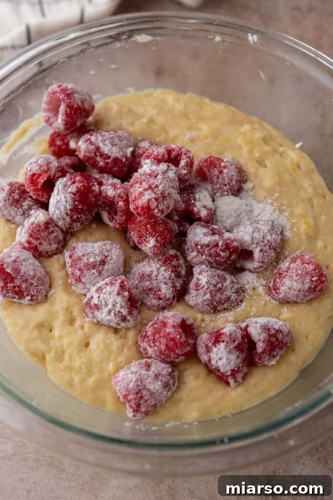 Raspberries gently folded into the muffin batter.