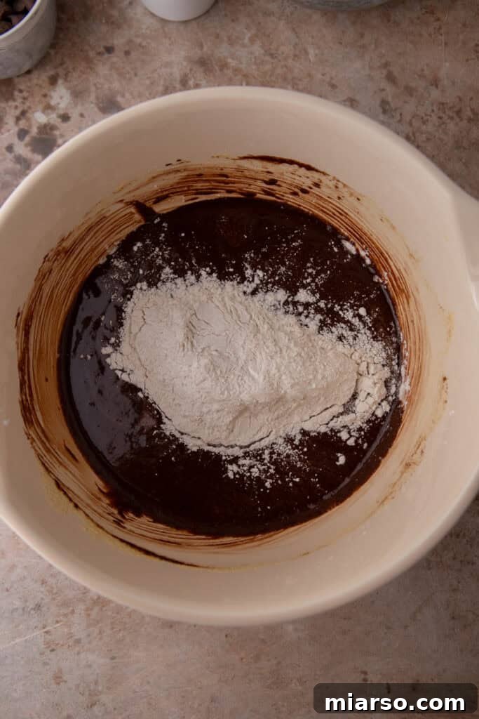Sifting dry ingredients into brownie batter