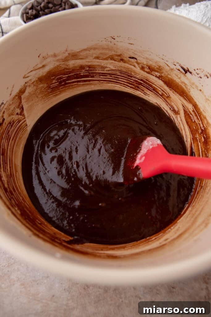 Folding dry ingredients into brownie batter