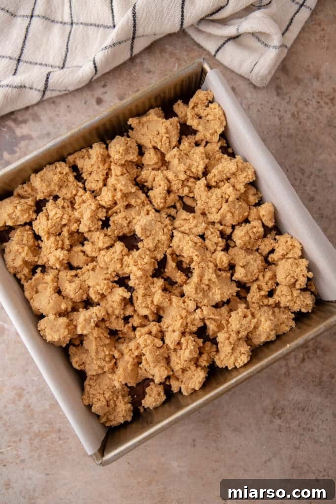 Peanut butter mixture crumbled over cooled brownies