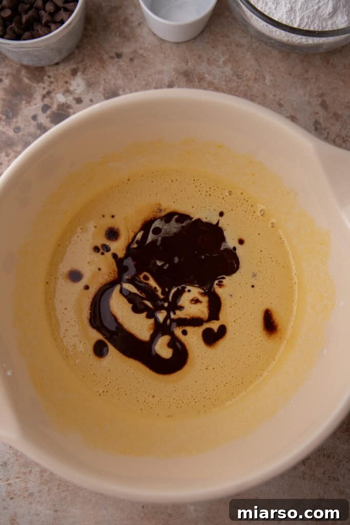 Adding chocolate mixture to egg mixture