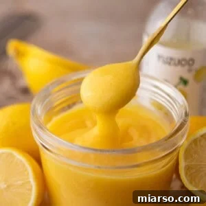 Yuzu Curd Recipe in a jar with a spoon