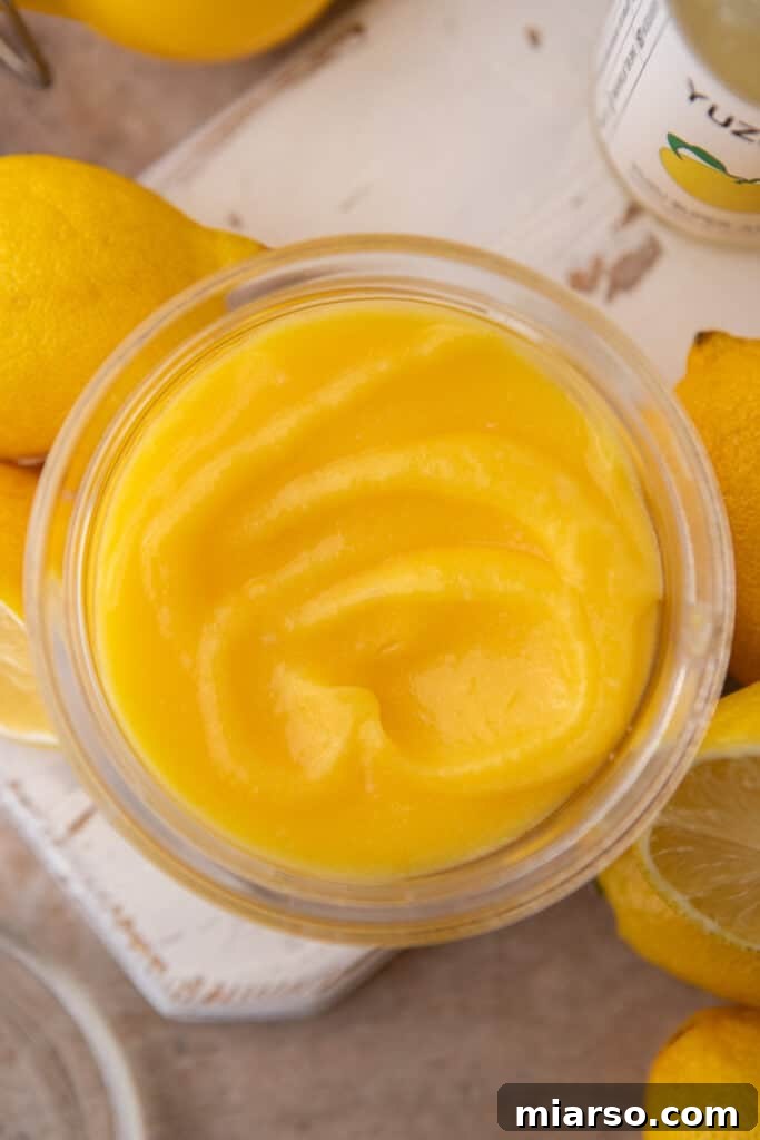 Chilled yuzu curd in a bowl with plastic wrap