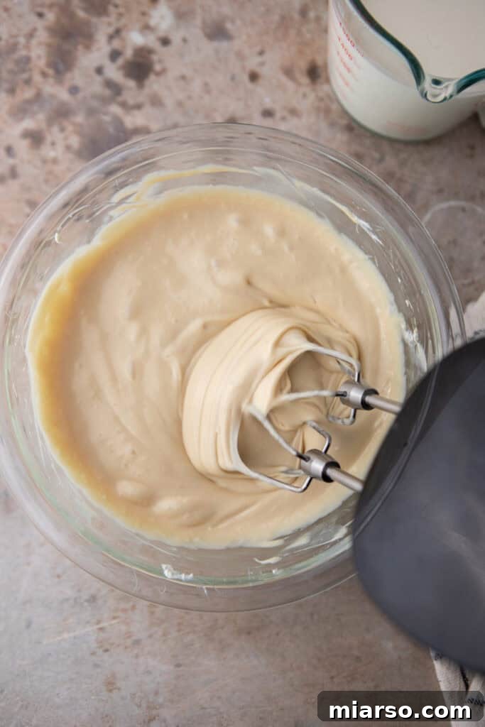 Sweetened condensed milk and vanilla added to cream cheese mixture