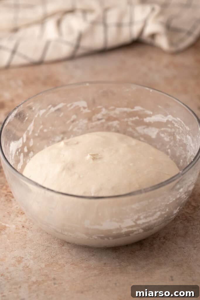 dough getting stretched and folded