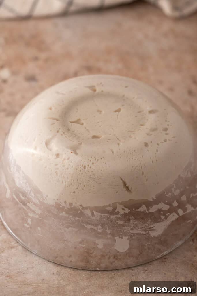 dough being flipped onto a table
