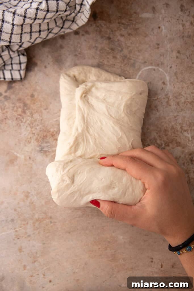 dough being rolled up