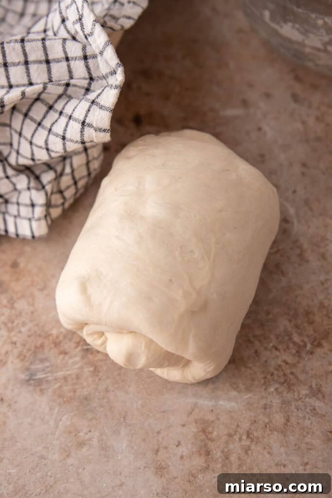 dough being rolled up