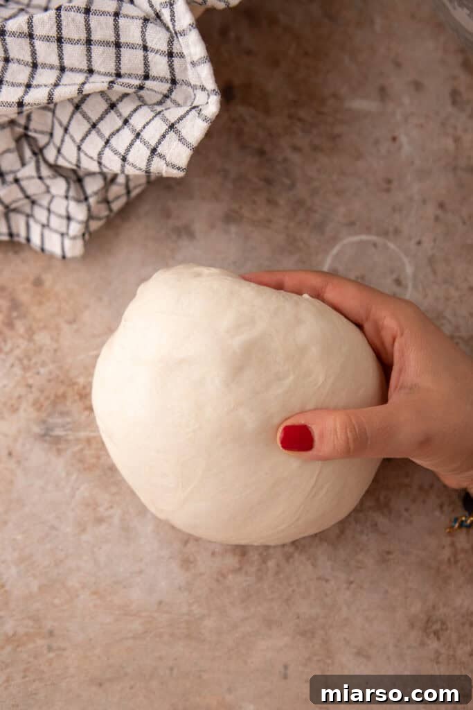 dough being rolled up