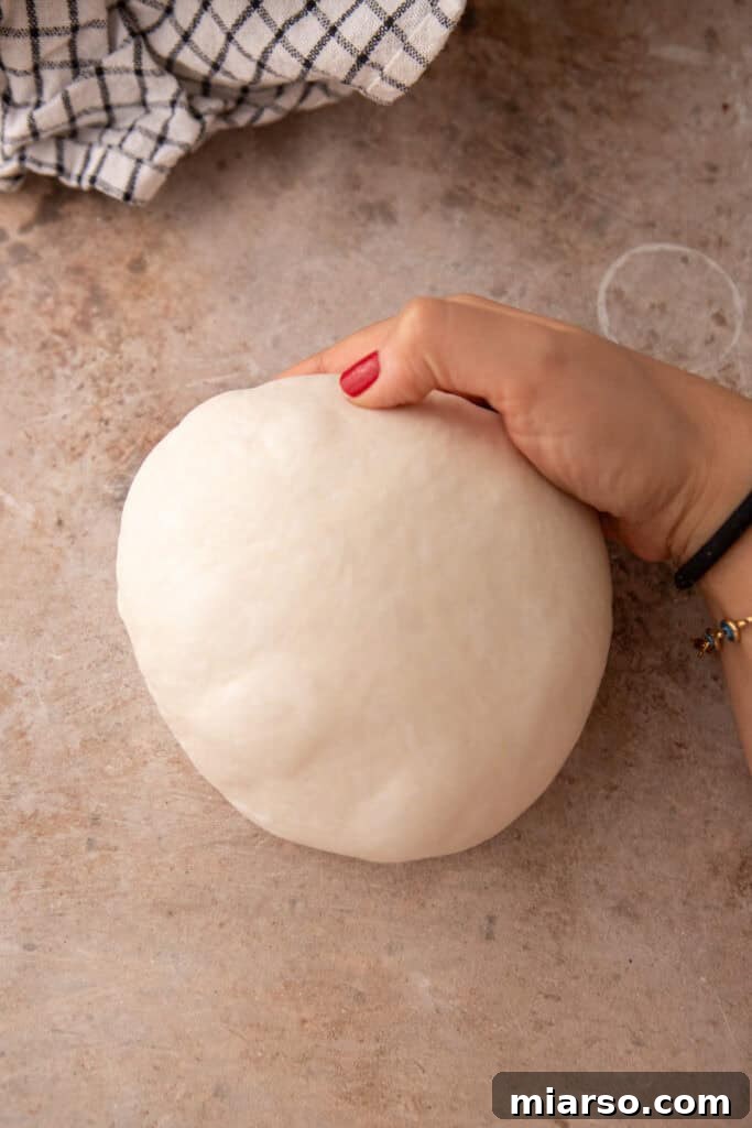dough being rolled up