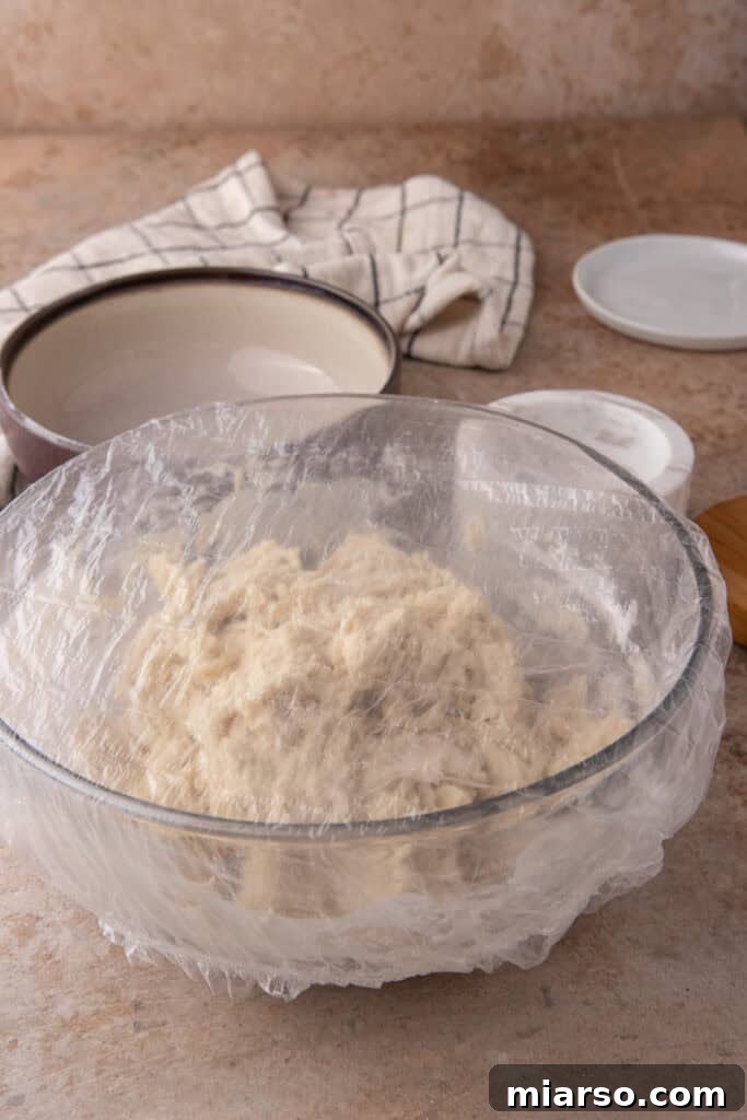 mixed ingredients in a bowl covered by plastic