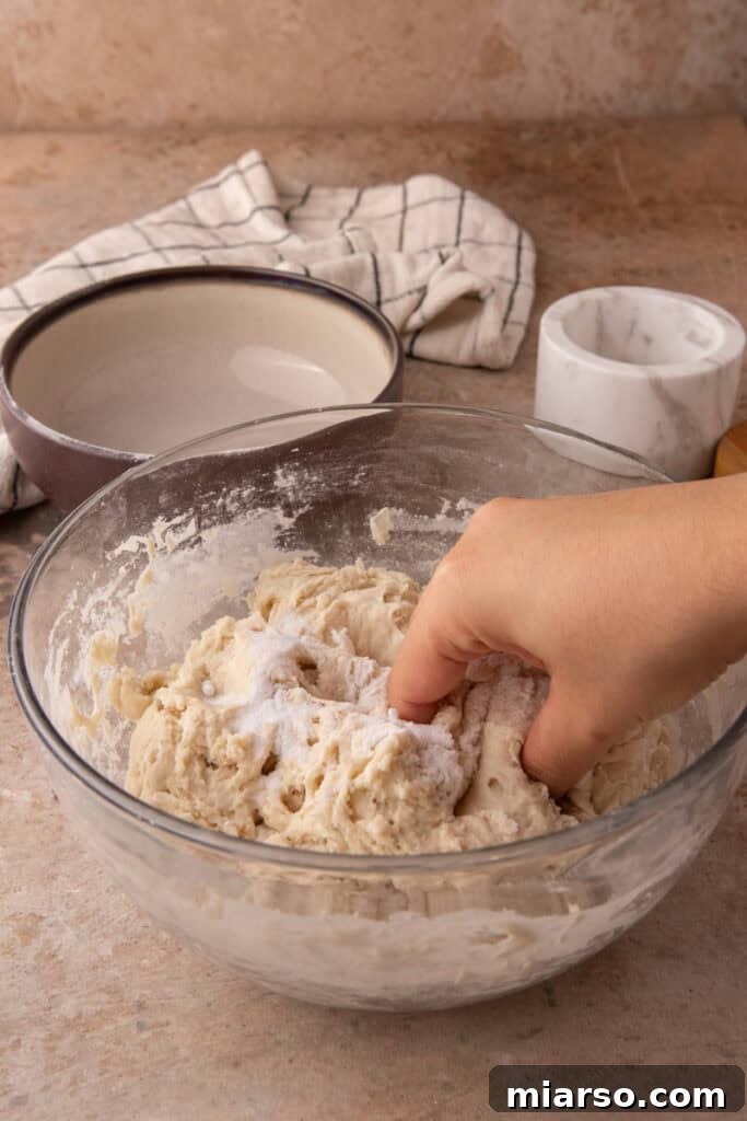 salt and dough being mixed in a bowl