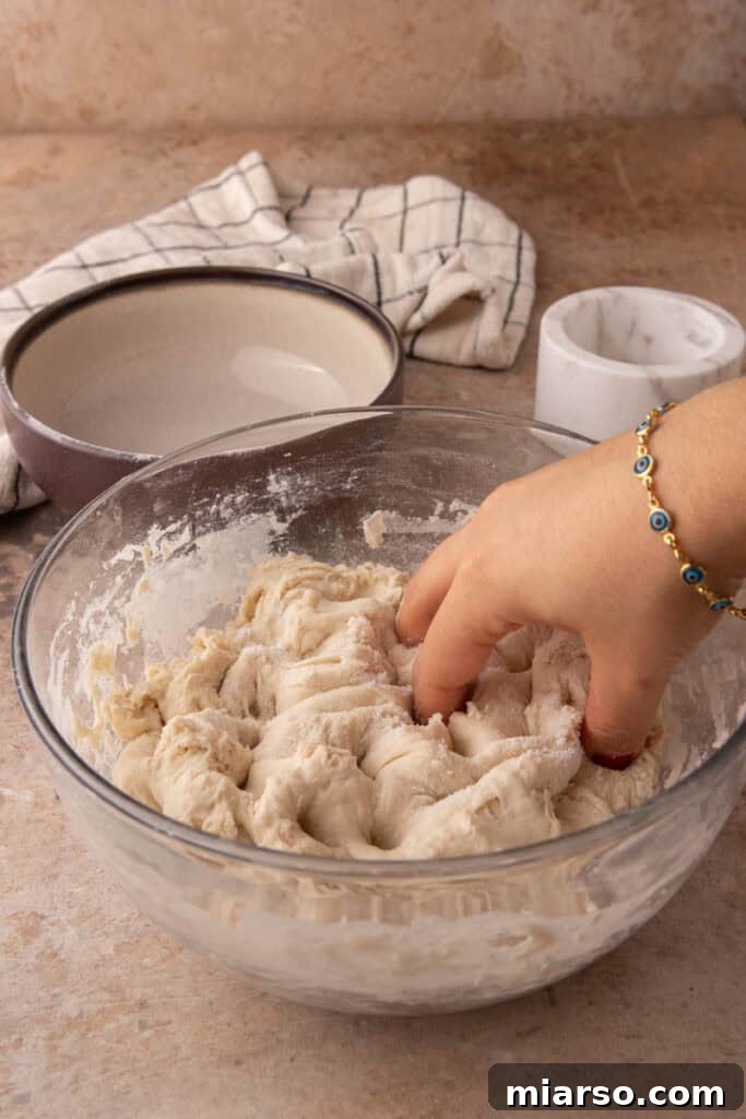 salt and dough being mixed in a bowl