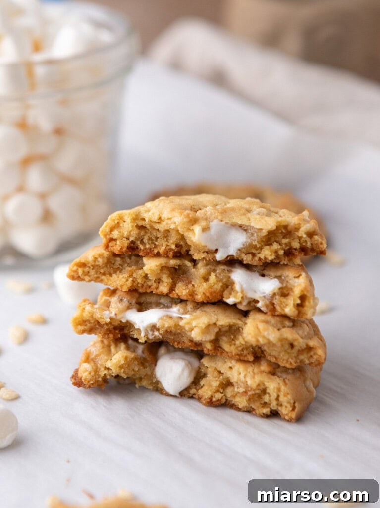 Stack of Costco Marshmallow Crispy Cookies, showcasing their golden-brown edges, melted marshmallow pockets, and crispy rice cereal texture.