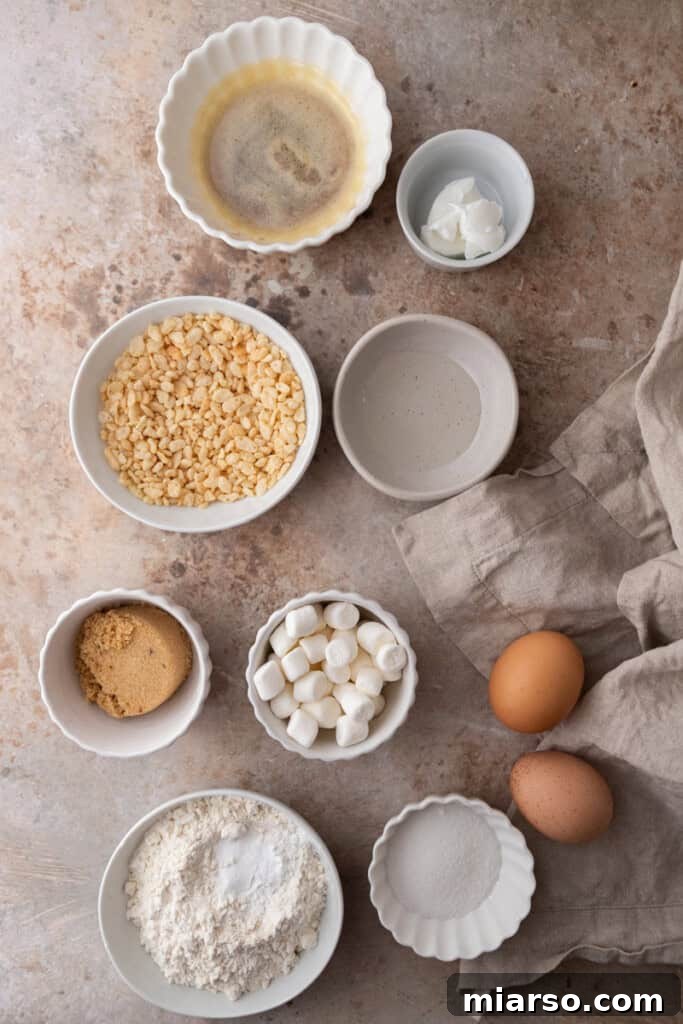 ingredients for baking displayed neatly on a kitchen counter, including butter, sugars, flour, and a mixing bowl.
